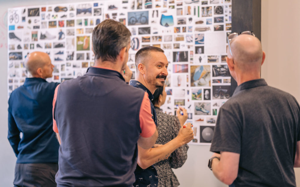 People standing gathered in a conference room