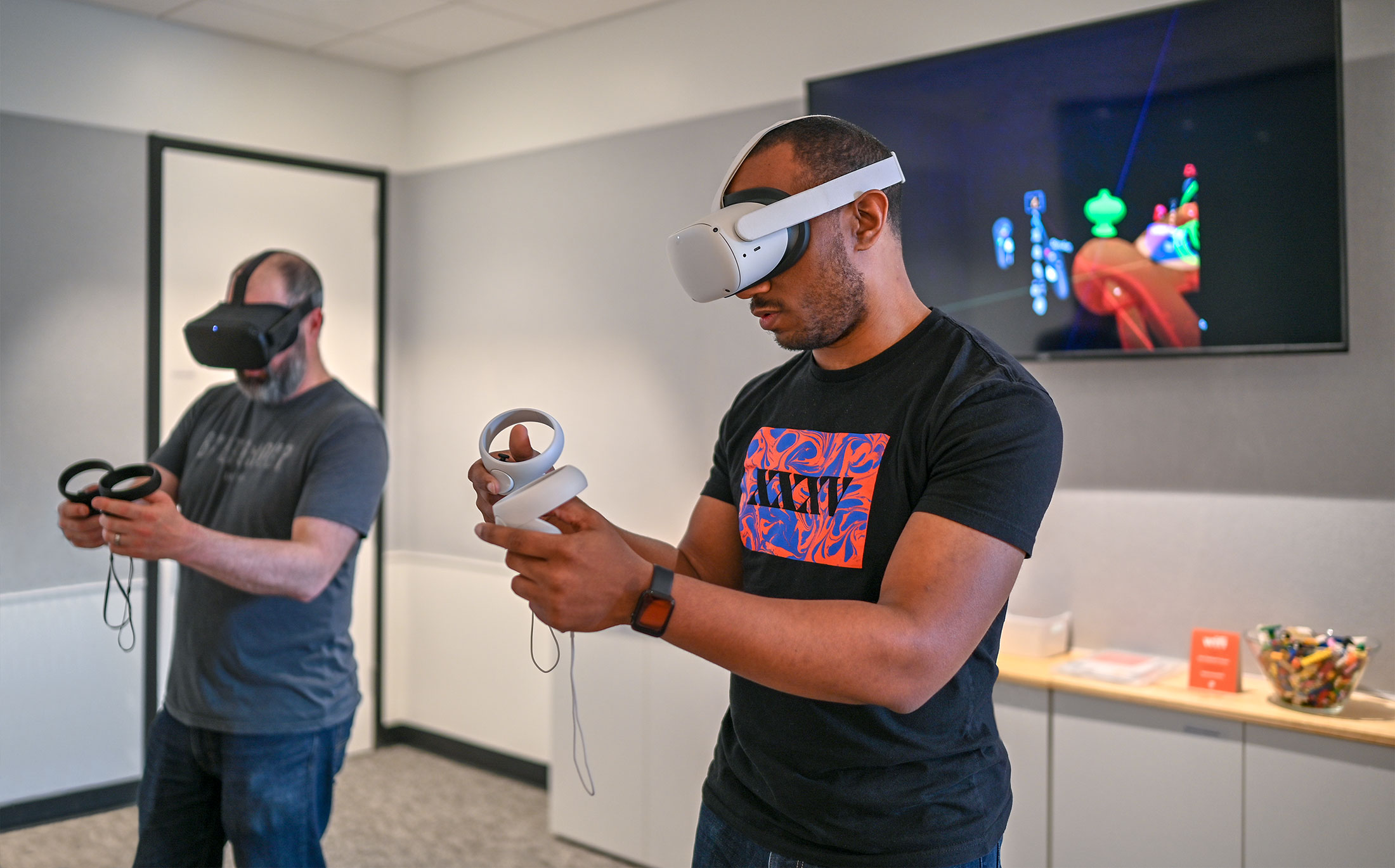 Two men interacting inside a virtual reality environment