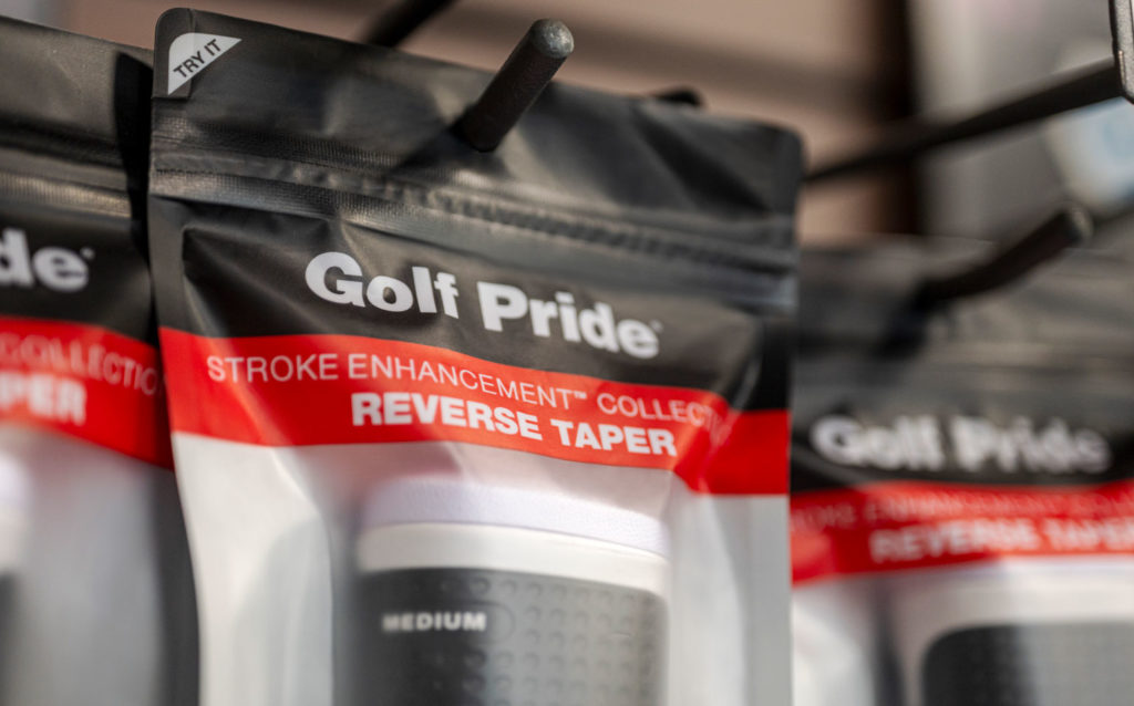 Close up of the top of Golf Pride Reverse Taper putter grip packaging in a retail environment