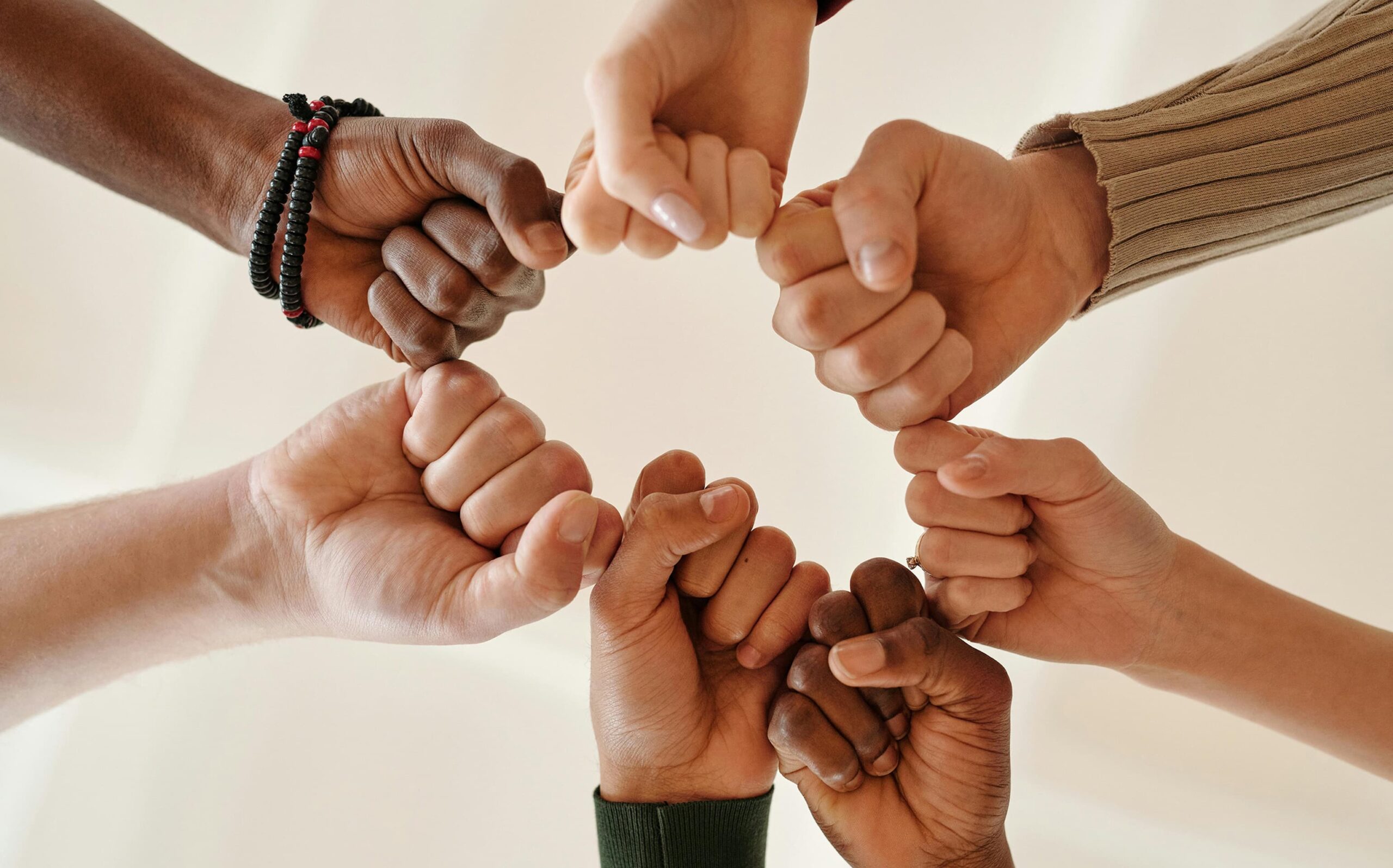 hands of multiple ethnicity in a circle