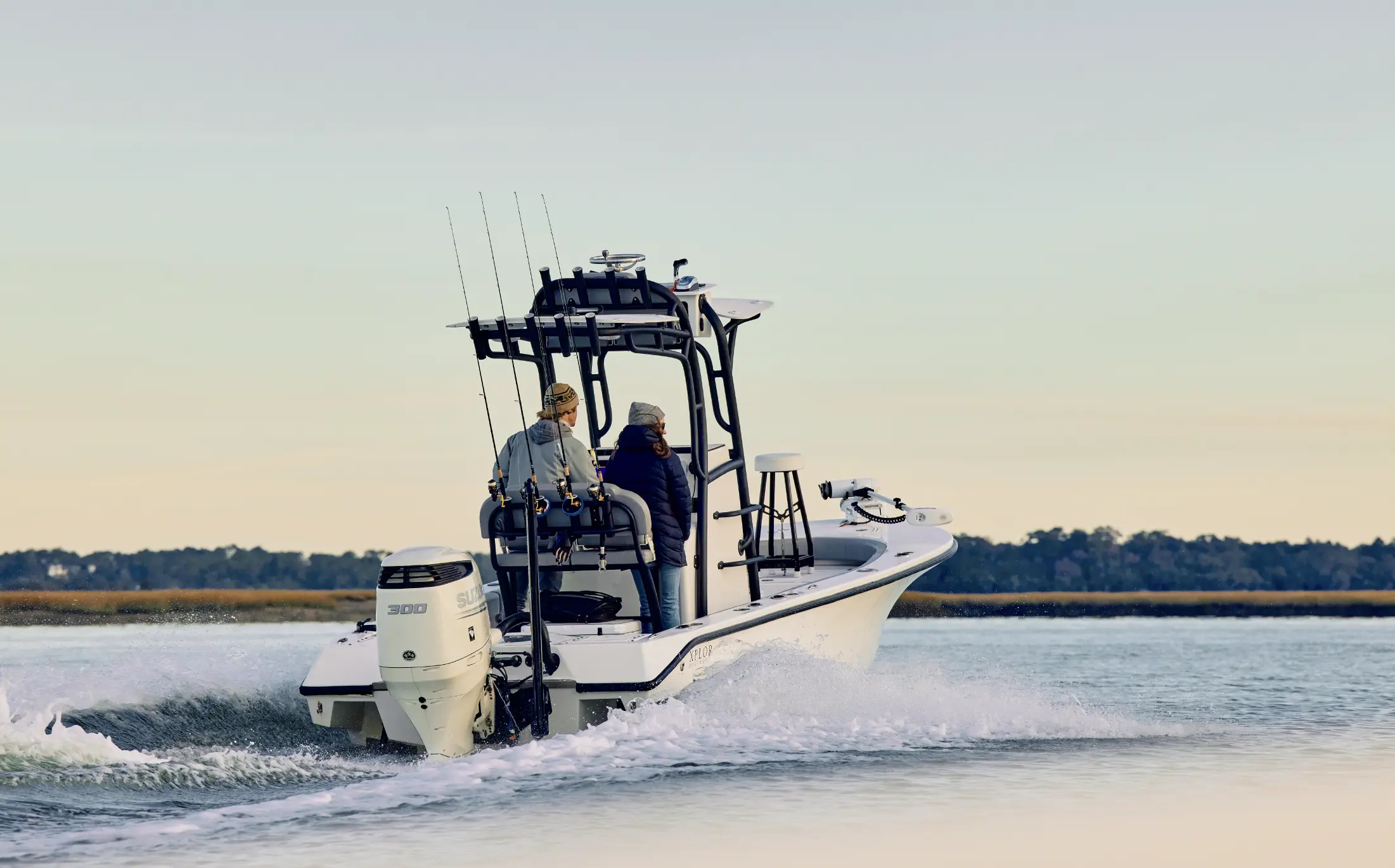 A couple on a fishing boat on an intracoastal waterway