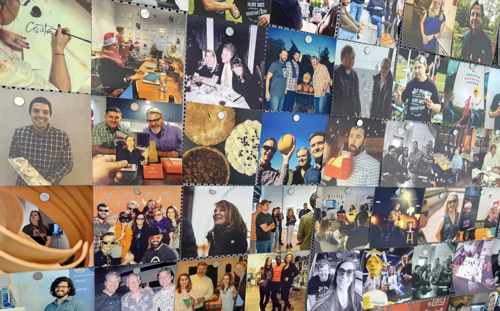 A wall of photos on a metal board hung with magnets