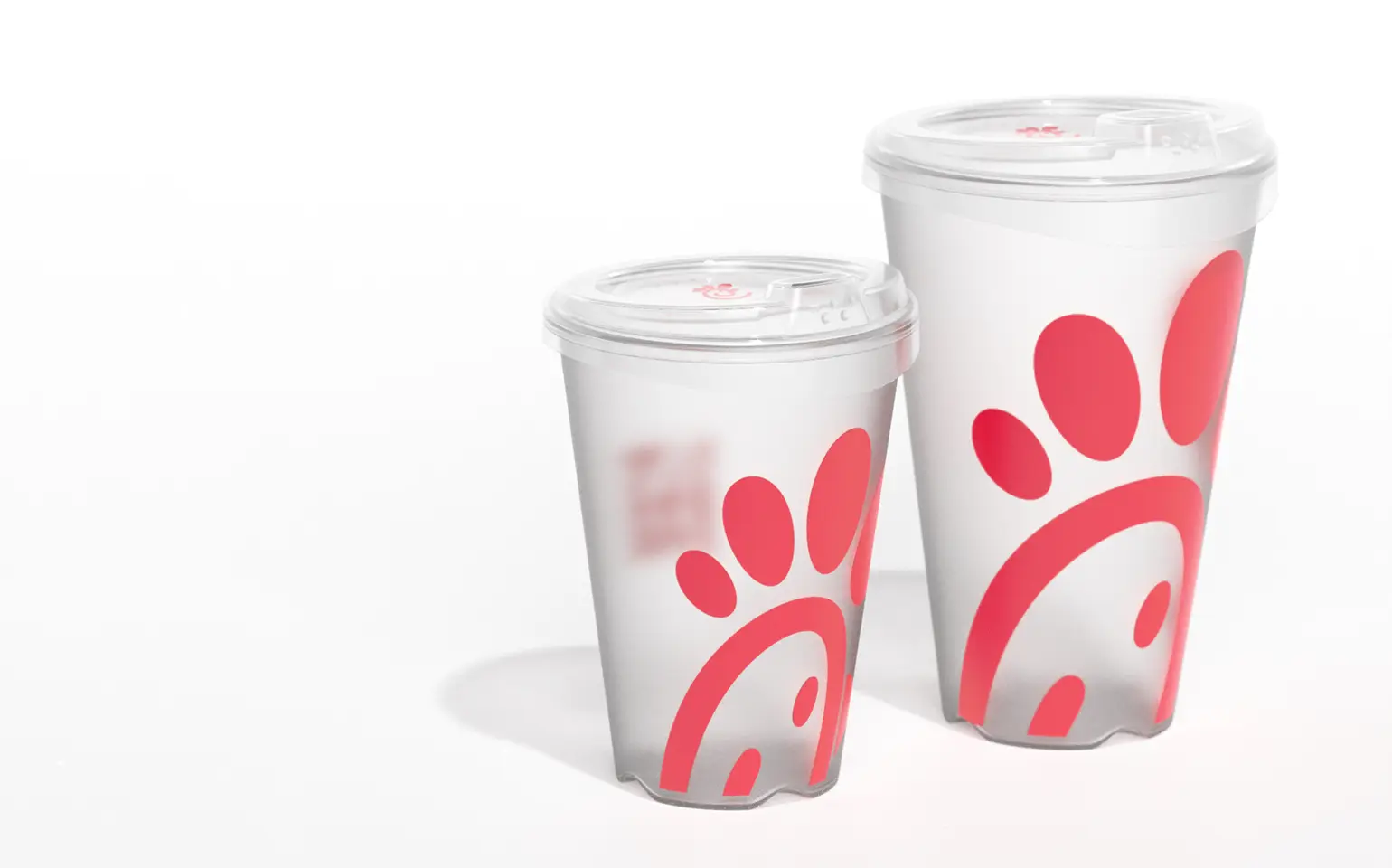 rendering of 2 sizes of clear Chick-fil-A reusable cups with lids