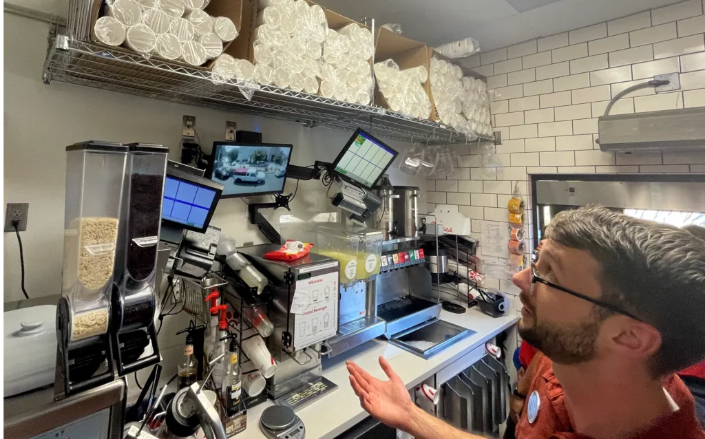 Interviewing a Chick-fil-A employee in the drive through area